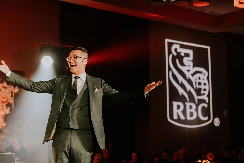 Bao performing on stage at a corporate gala